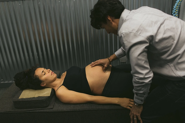 Dr Bobby Fano -pregnant woman getting spinal adjustment for pregnancy comfort