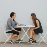 Brandi Fano talking with coaching client - health and lifestyle coaching